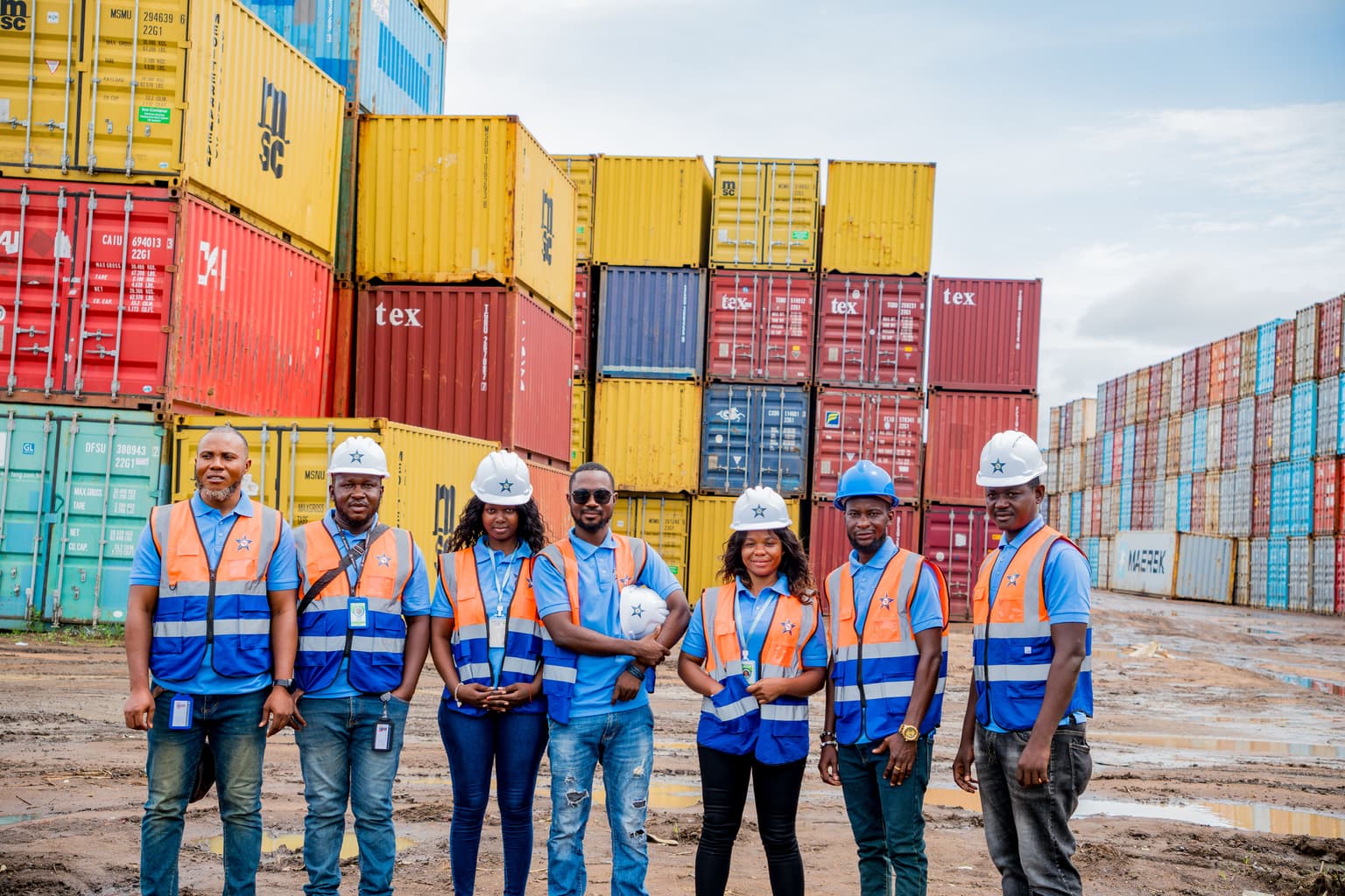 Customs clearing professional near cargo containers at Freetown port.